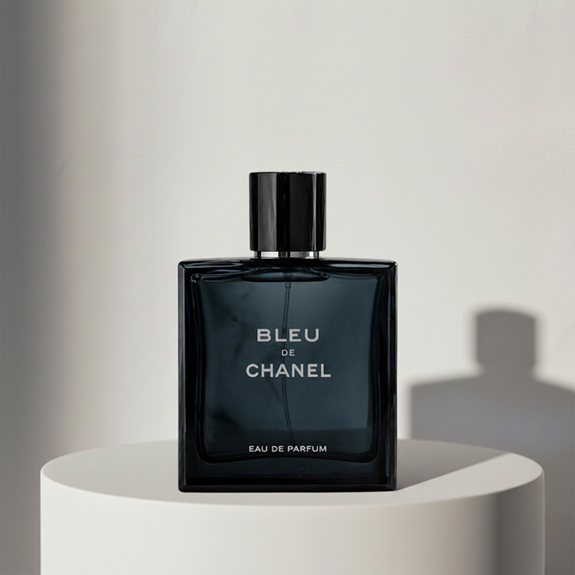 Chanel Bleu de Chanel eau de parfum in dark blue glass bottle with black cap – full-size bottle available at luxuryperfumesamples.com