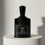 Creed Aventus Absolu eau de parfum in black glass bottle with textured cap – full-size bottle available at luxuryperfumesamples.com
