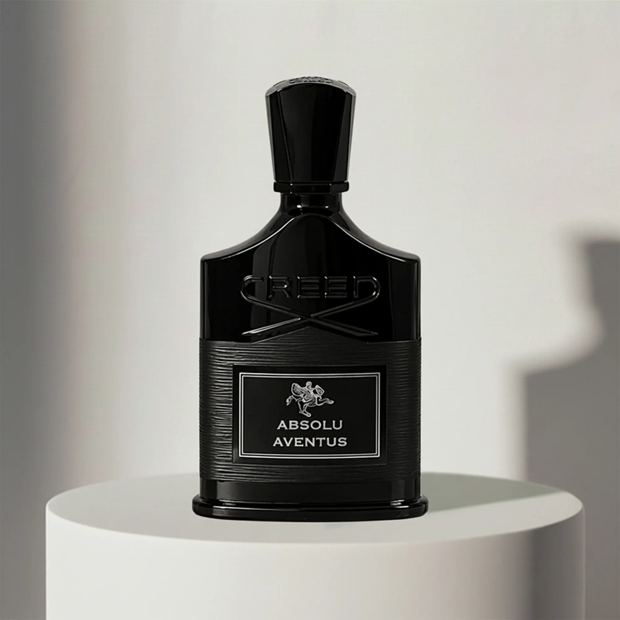 Creed Aventus Absolu eau de parfum in black glass bottle with textured cap – full-size bottle available at luxuryperfumesamples.com
