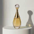 Dior J'adore eau de parfum in golden amphora-shaped glass bottle with crystal ball cap – full-size bottle available at luxuryperfumesamples.com
