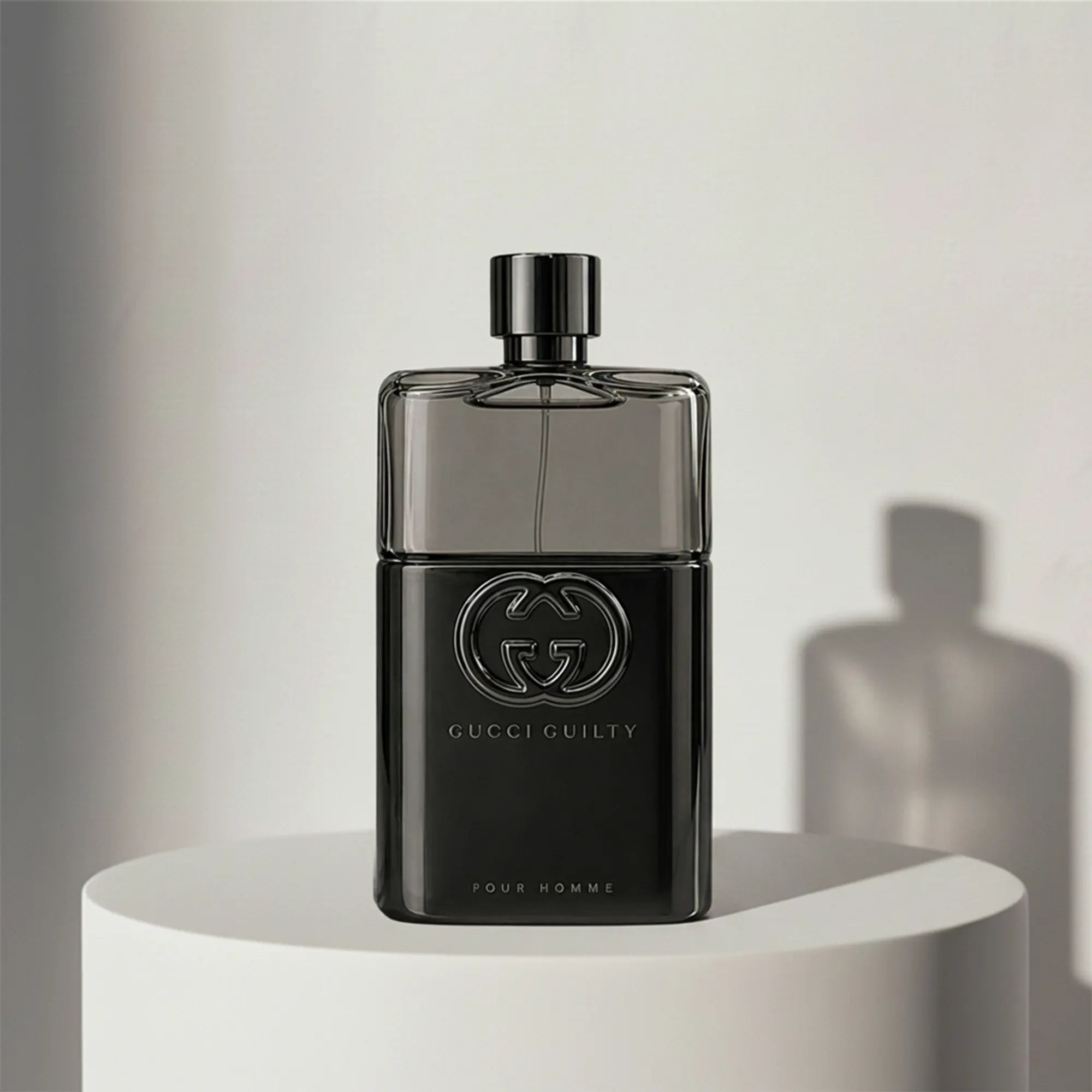 Gucci Guilty Pour Homme eau de toilette in black glass bottle with black cap – full-size bottle available at luxuryperfumesamples.com
