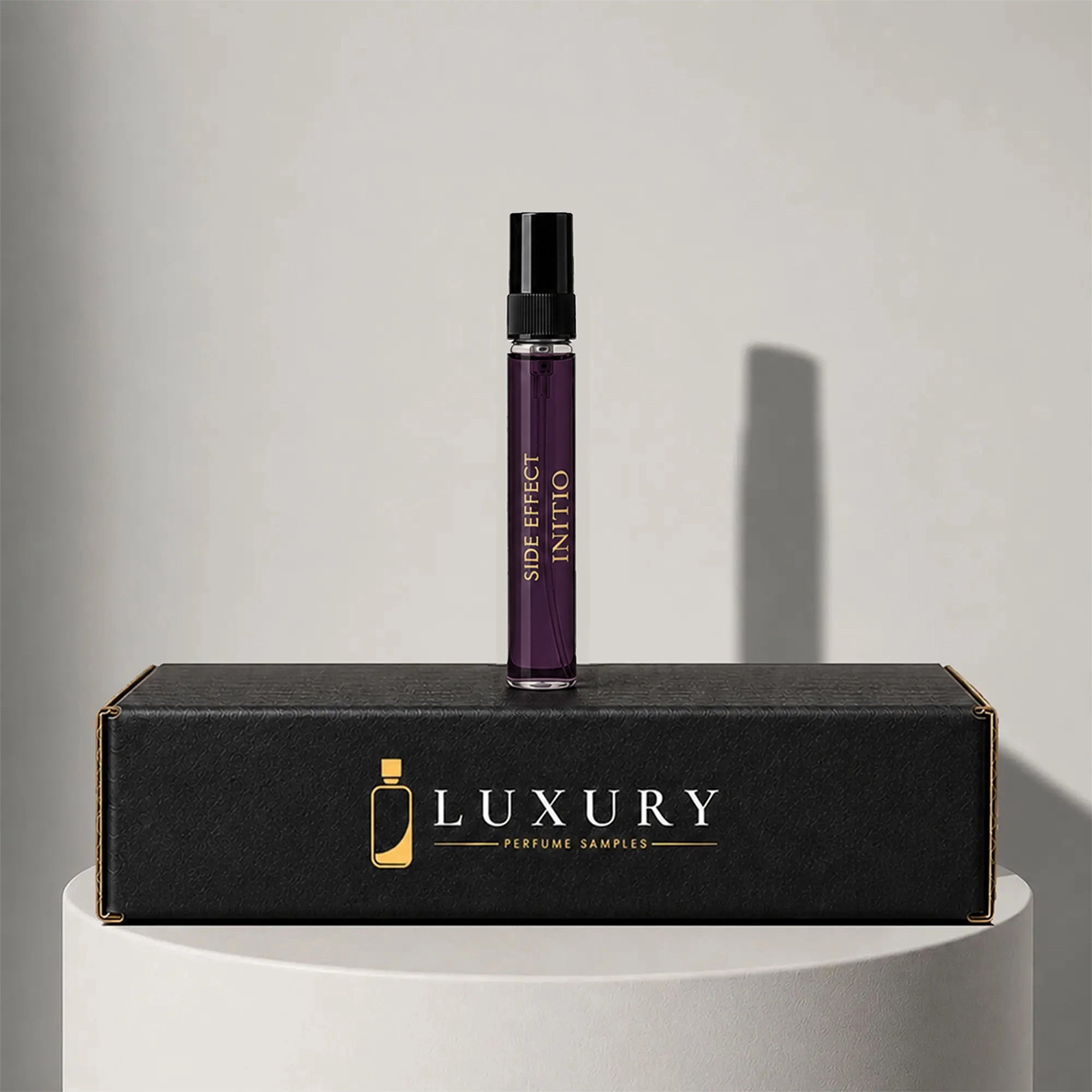Initio Side Effect eau de parfum sample vial, displayed on Luxury Perfume Samples branded box – sample decant available at luxuryperfumesamples.com
