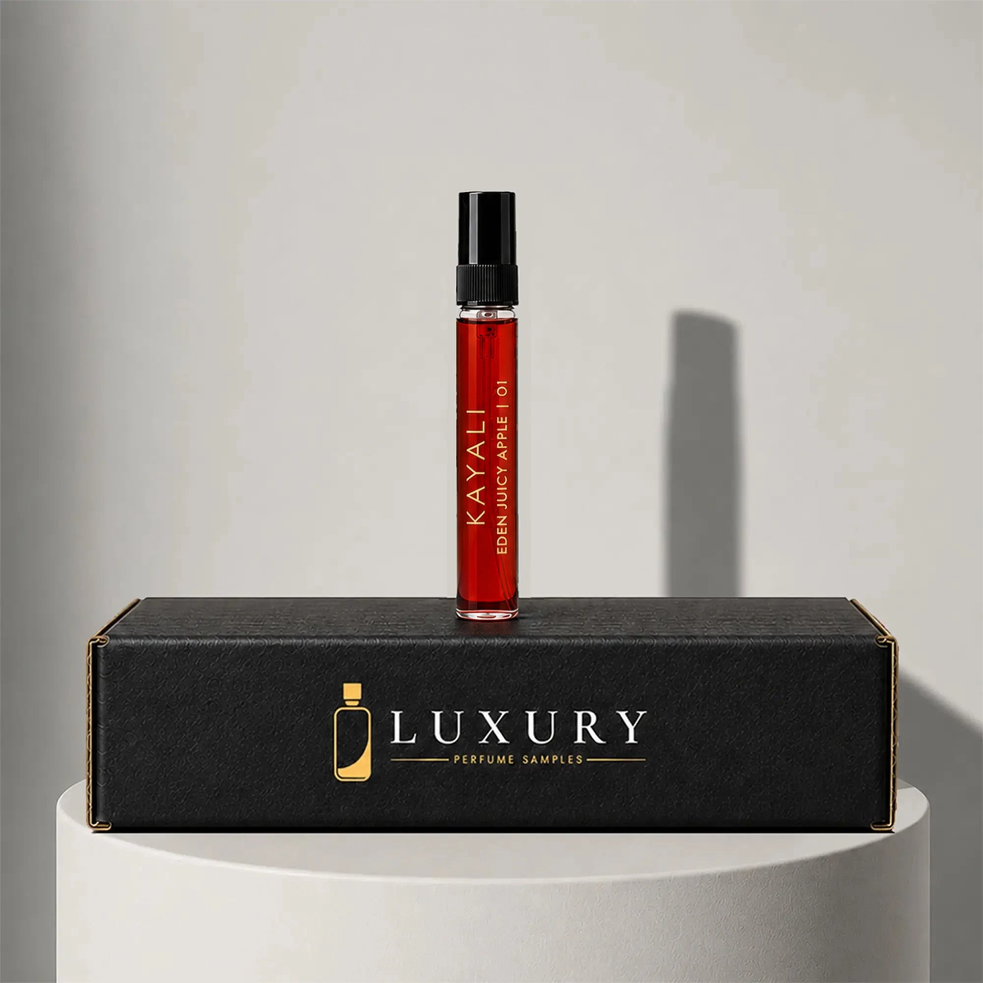 Kayali Eden Juicy Apple 01 eau de parfum sample vial, displayed on Luxury Perfume Samples branded box – sample decant available at luxuryperfumesamples.com