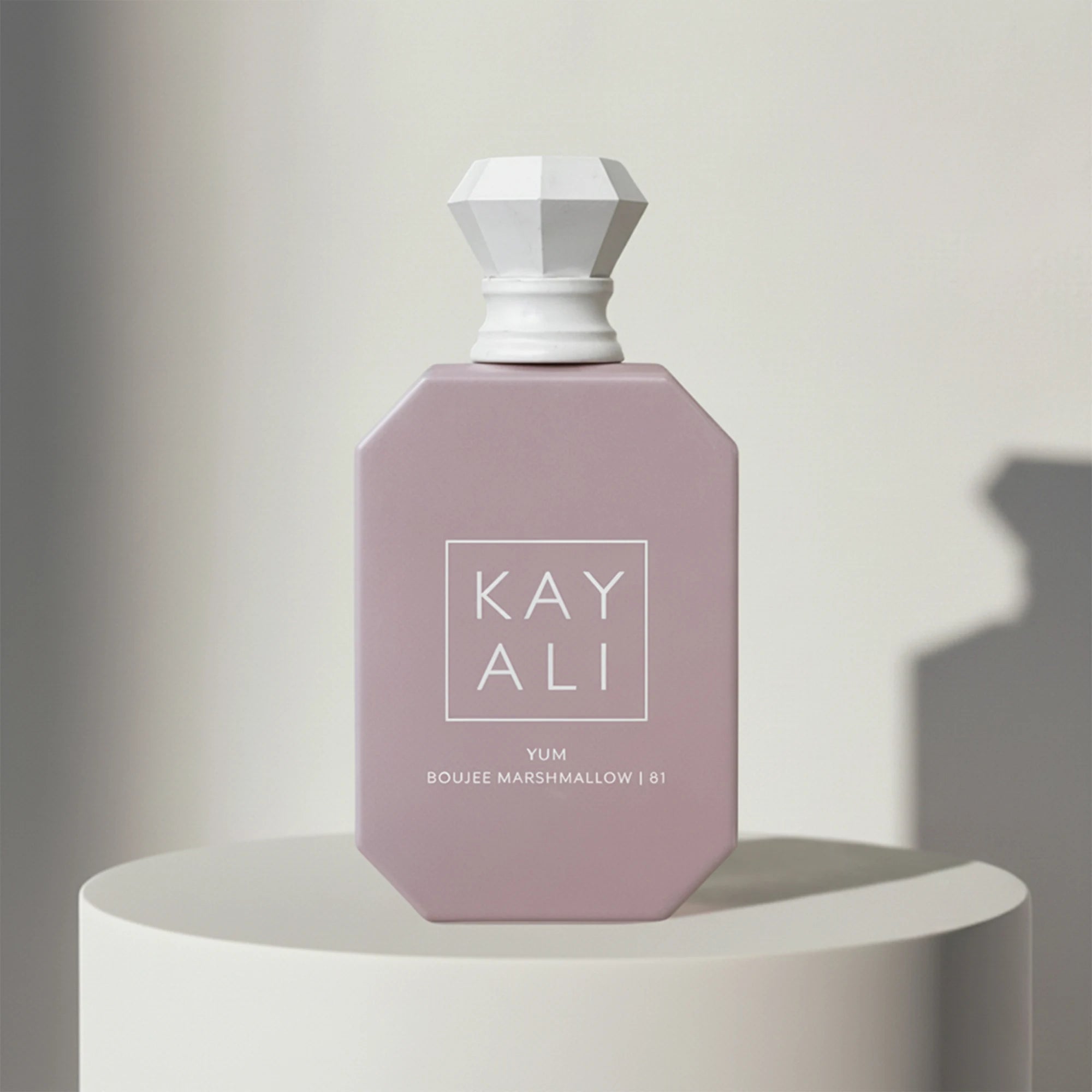 Kayali Yum Boujee Marshmallow 81 eau de parfum in dusty pink glass bottle with grey cap – full-size bottle available at luxuryperfumesamples.com