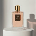Kilian Love, Don't Be Shy eau de parfum in soft pink glass bottle with gold cap – full-size bottle available at luxuryperfumesamples.com