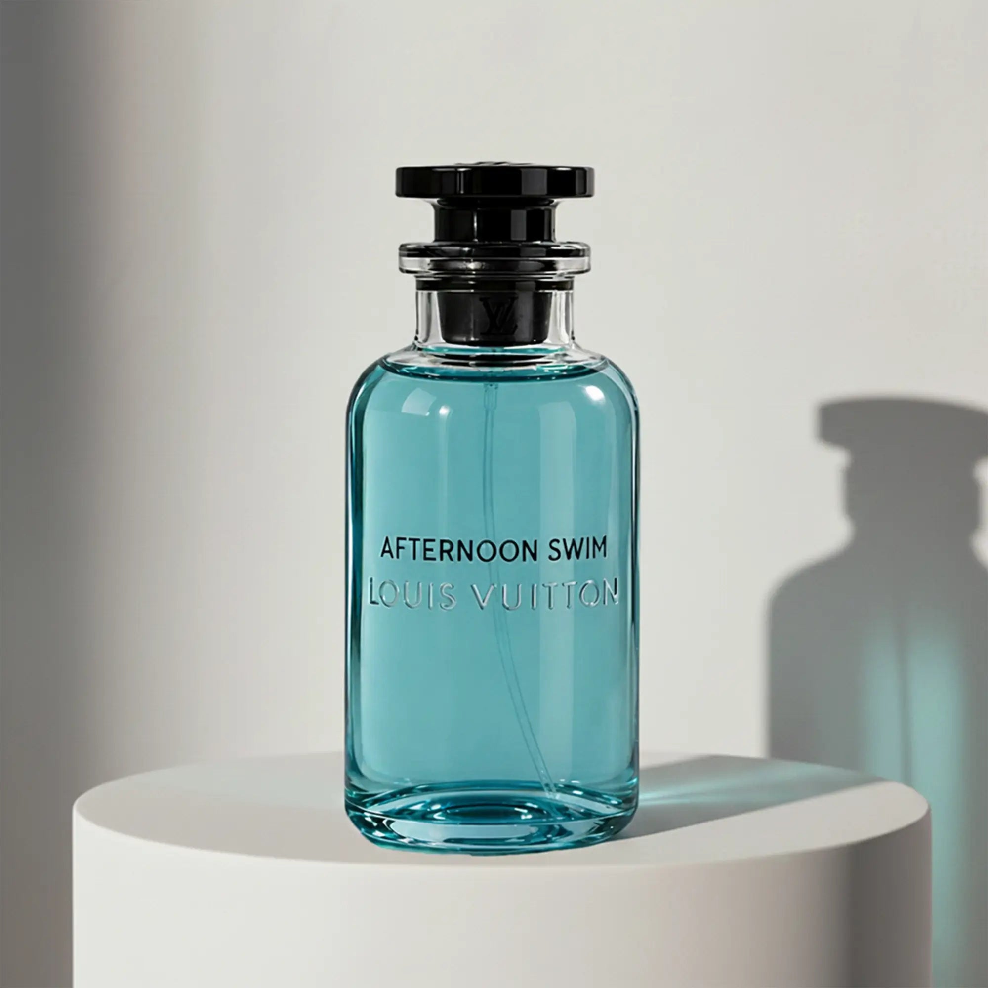 Louis Vuitton Afternoon Swim eau de toilette in turquoise glass bottle with black cap and stopper – full-size bottle available at luxuryperfumesamples.com