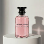 Louis Vuitton Heures d'Absence eau de parfum in soft pink glass bottle with black cap and stopper – full-size bottle available at luxuryperfumesamples.com