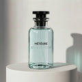 Louis Vuitton Météore eau de parfum in pale blue glass bottle with black cap – full-size bottle available at luxuryperfumesamples.com
