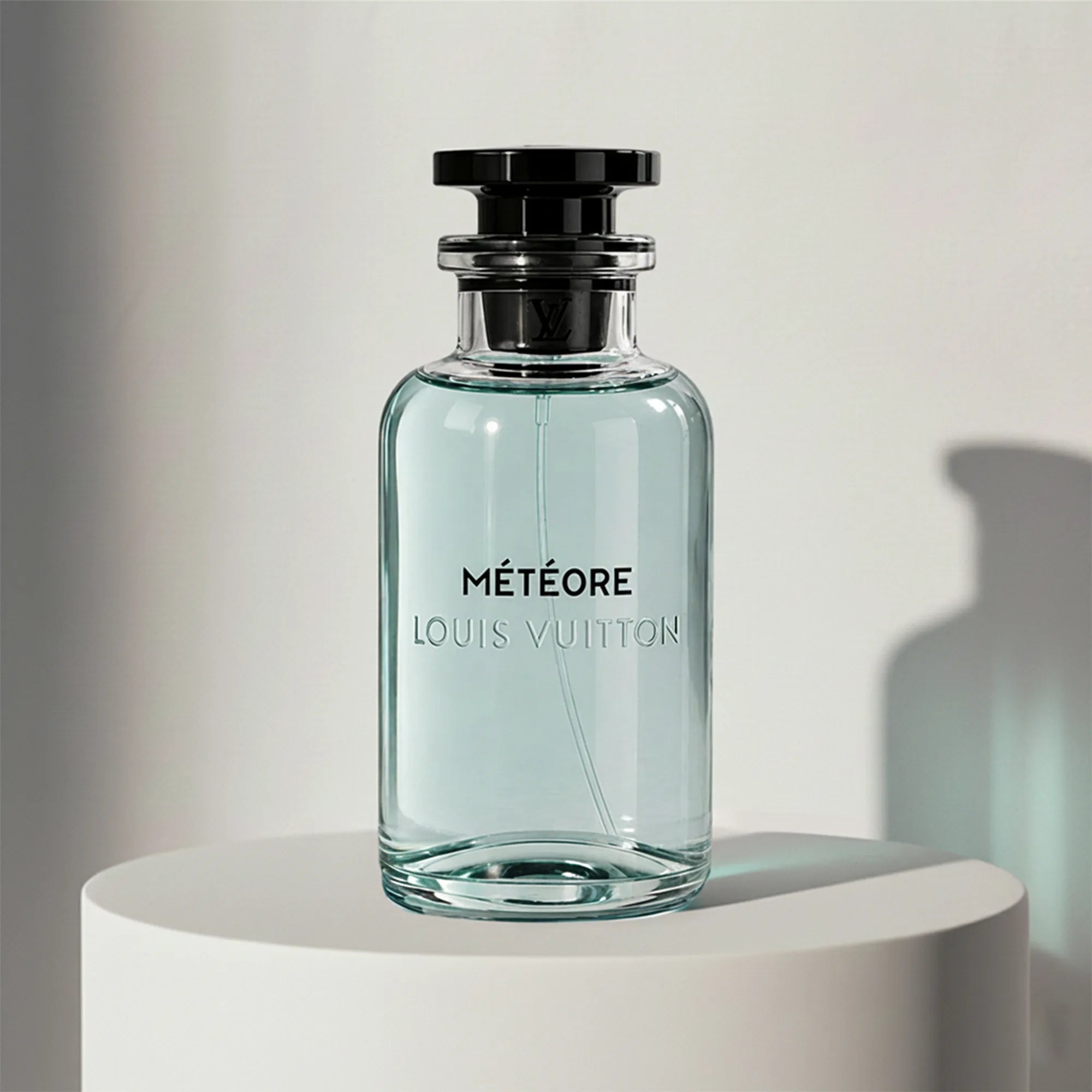 Louis Vuitton Météore eau de parfum in pale blue glass bottle with black cap – full-size bottle available at luxuryperfumesamples.com
