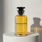 Louis Vuitton Nouveau Monde eau de parfum in golden amber glass bottle with black cap and stopper – full-size bottle available at luxuryperfumesamples.com