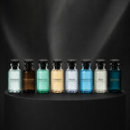 Louis Vuitton fragrance collection featuring eight eau de parfum and eau de toilette bottles on black backdrop, including Imagination, Ombre Nomade and Pacific Chill – full-size bottles available at luxuryperfumesamples.com
