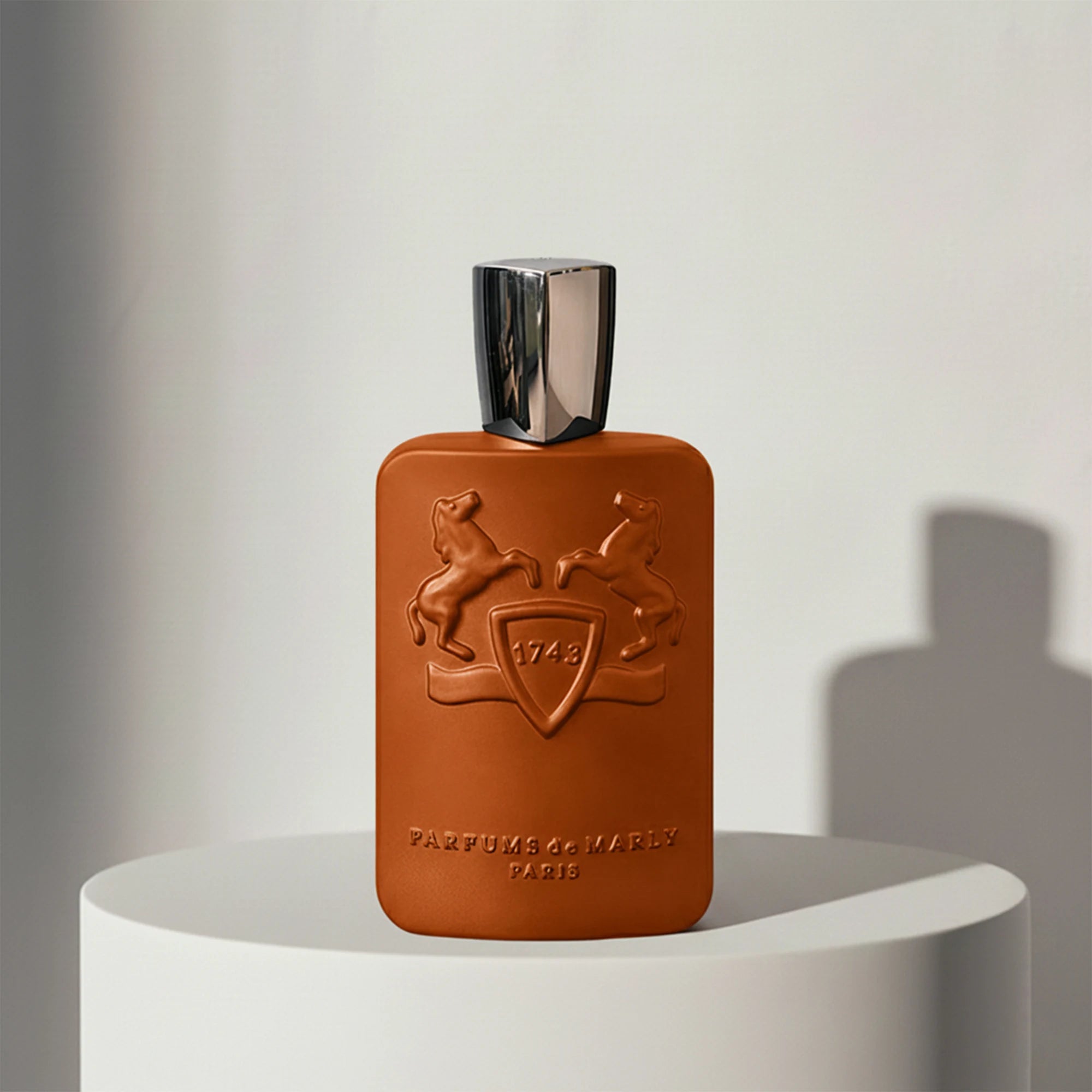 Parfums de Marly Althaïr eau de parfum in brown leather-textured glass bottle with silver cap – full-size bottle available at luxuryperfumesamples.com
