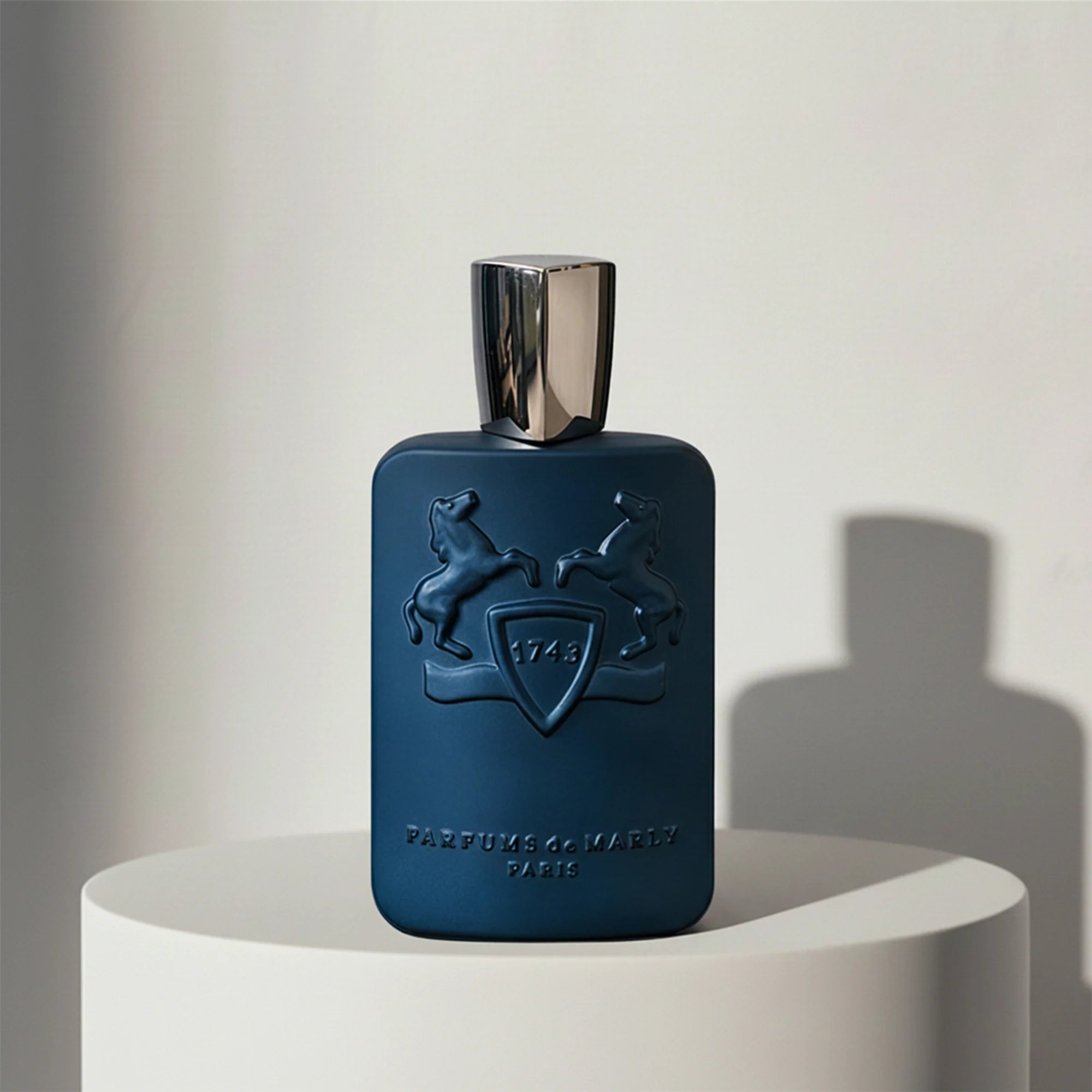 Parfums de Marly Layton eau de parfum in navy blue leather-textured glass bottle with silver cap – full-size bottle available at luxuryperfumesamples.com
