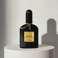 Tom Ford Black Orchid eau de parfum in black ribbed glass bottle with gold cap – full-size bottle available at luxuryperfumesamples.com
