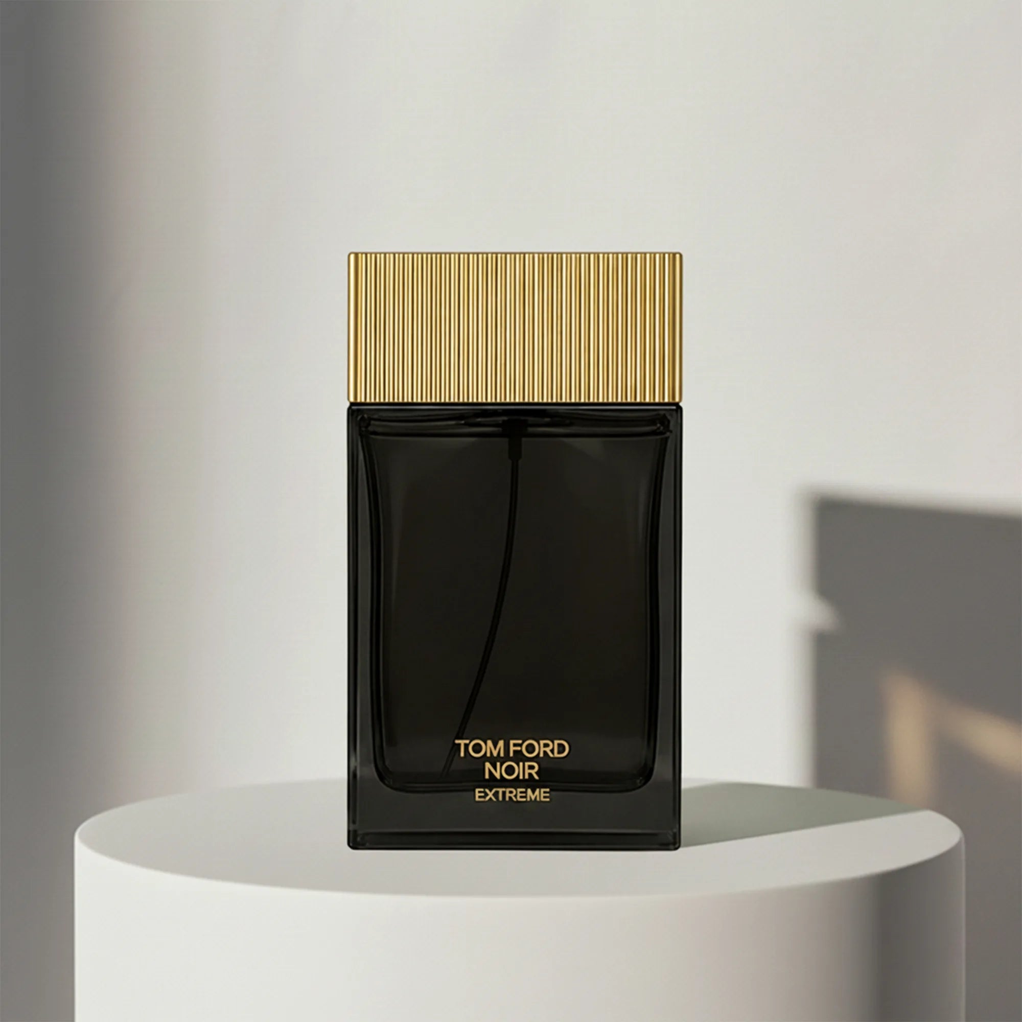 Tom Ford Noir Extreme eau de parfum in black glass bottle with ribbed gold cap – full-size bottle available at luxuryperfumesamples.com
