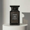 Tom Ford Oud Wood eau de parfum in black glass bottle, 100ml – full-size bottle available at luxuryperfumesamples.com
