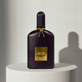 Tom Ford Velvet Orchid eau de parfum in deep purple ribbed glass bottle with gold cap – full-size bottle available at luxuryperfumesamples.com
