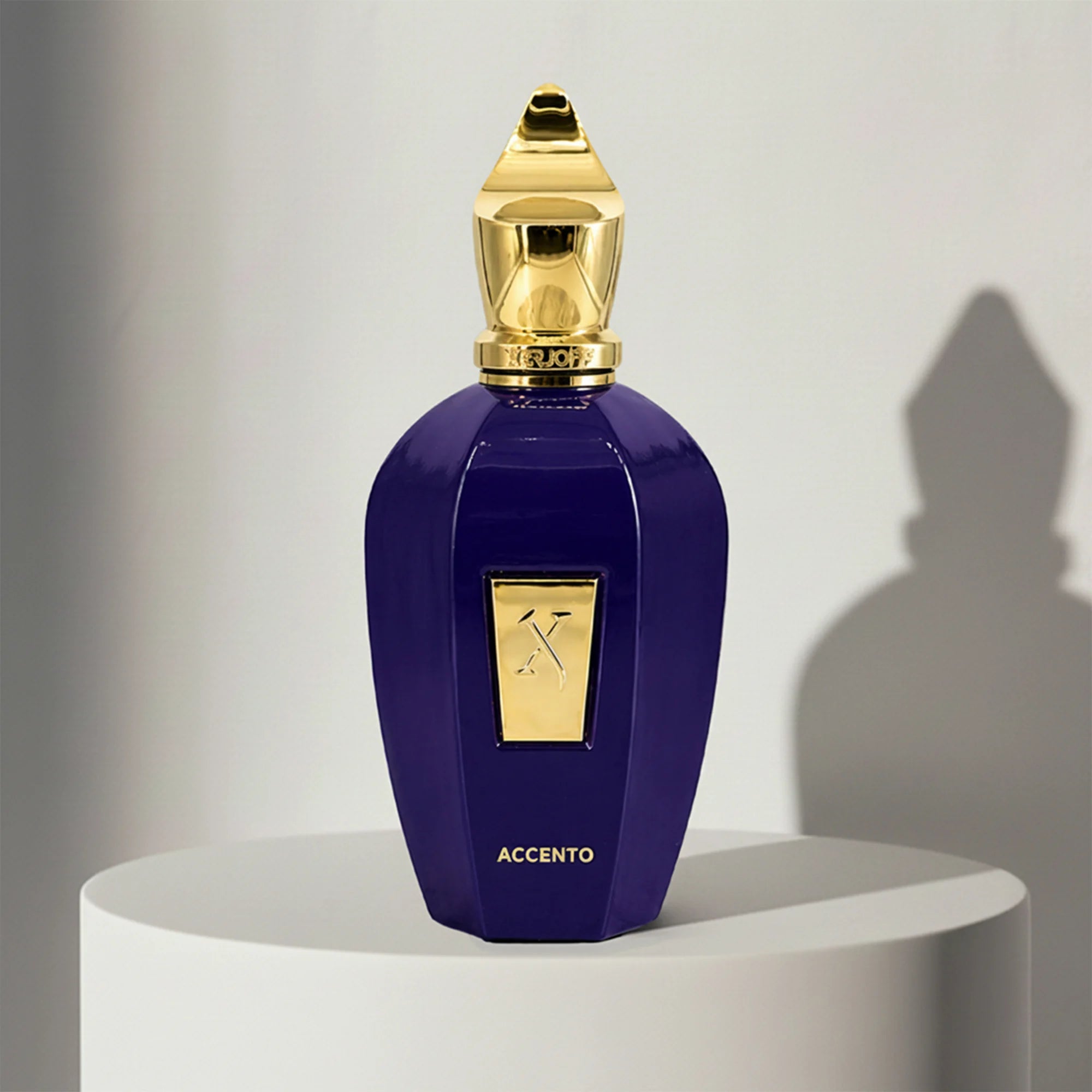 Xerjoff Accento eau de parfum in deep purple glass bottle with gold cap – full-size bottle available at luxuryperfumesamples.com