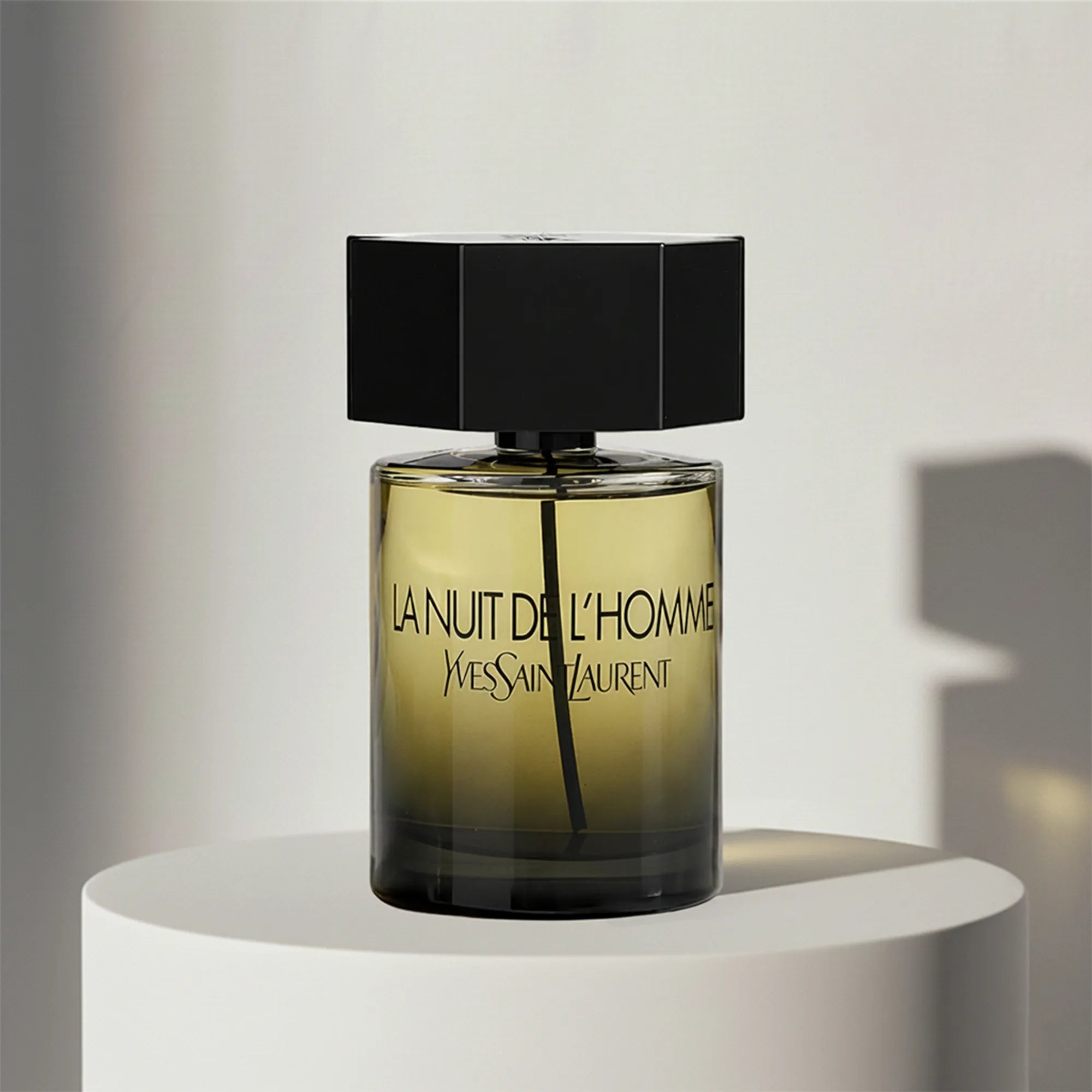 Yves Saint Laurent La Nuit de l'Homme eau de toilette in amber glass bottle with black cap – full-size bottle available at luxuryperfumesamples.com
